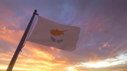 Cyprus Flag on Flagpole by Evening Sunset Sky