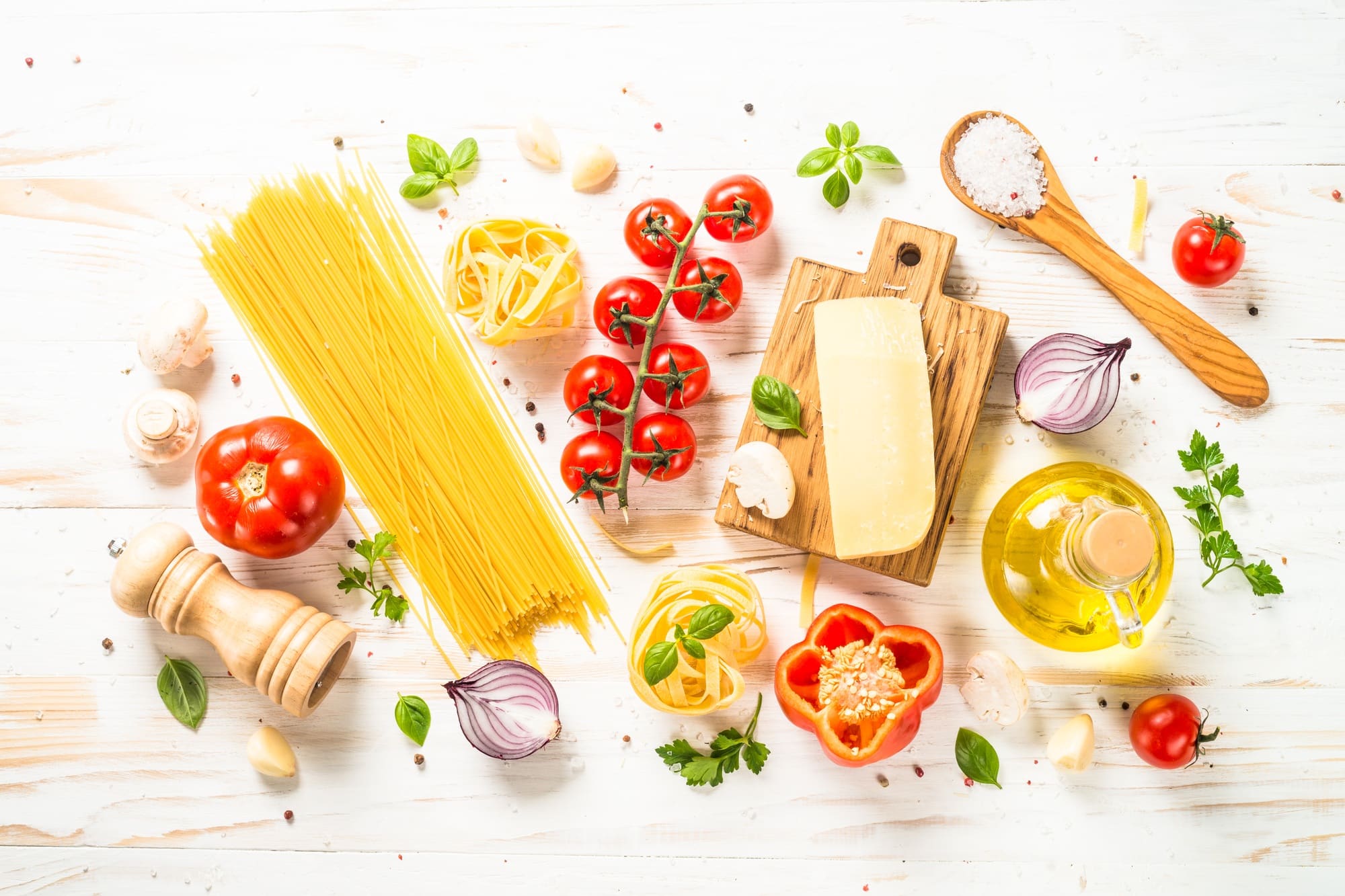 Italian food background at white bkitchen table